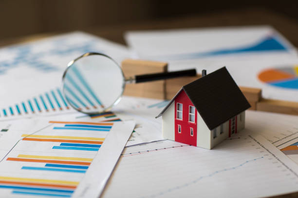 Miniature House on A Financial Graph Miniature House on A Financial Graph real estates stock pictures, royalty-free photos & images