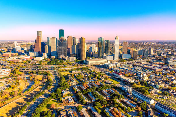 Over Houston The downtown skyline and surrounding metropolitan area of Houston, Texas shot from an altitude of about 1500 feet during a helicopter photo flight. texas stock pictures, royalty-free photos & images